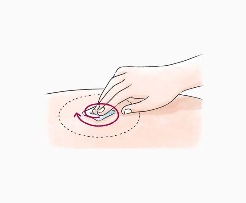 注射部位を円を描くように消毒する方法を示した図